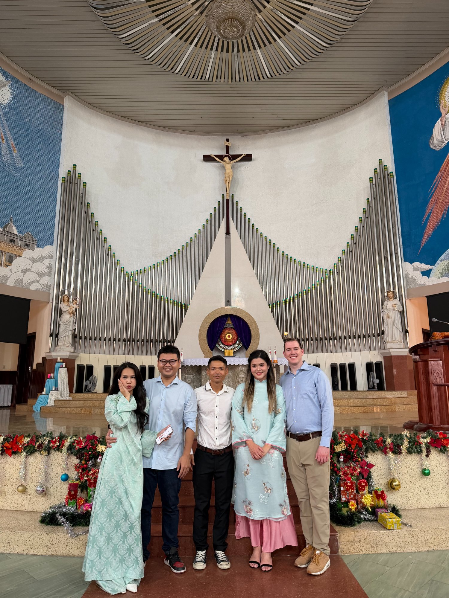 Church with Nguyên's siblings in Vietnam (L→R: Loan, Quang, Hải)